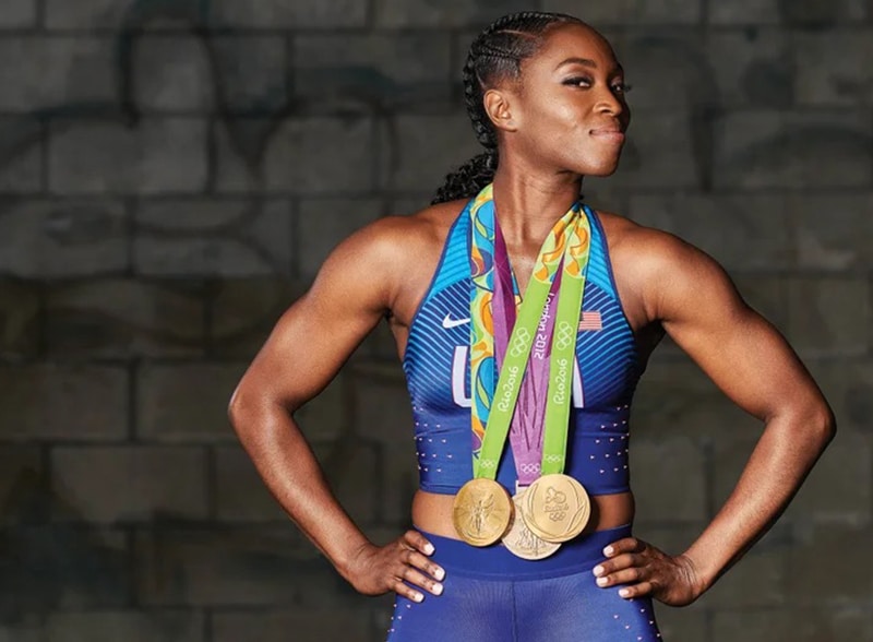 photo of Tianna Madison wearing gold medals
